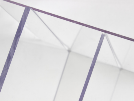 Clear polycarbonate roofing used in a modern commercial canopy installation